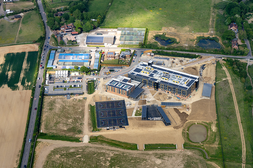 An aerial photograph taken in May 2025 showing the construction progress of the new school at Chilmington Green, Ashford, Kent